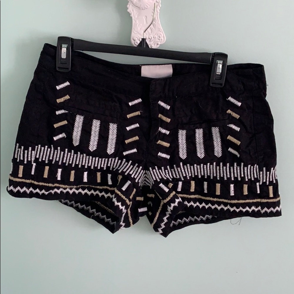 black shorts w gold and white pattern